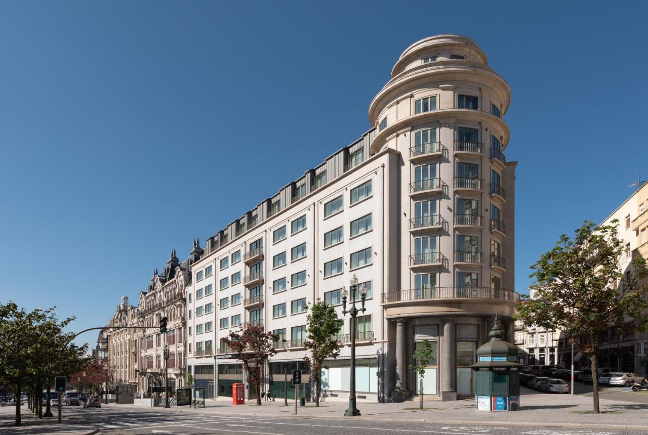 Eurostars Aliados Hotel Porto Bagian luar foto The former department store, now apartments