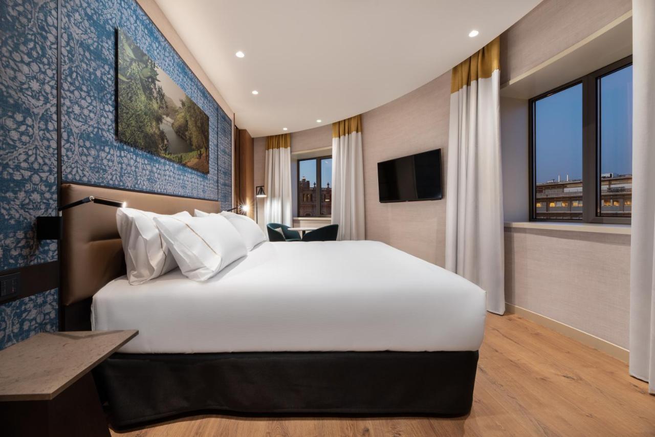 Eurostars Aliados Hotel Porto Bagian luar foto A bedroom at the hotel