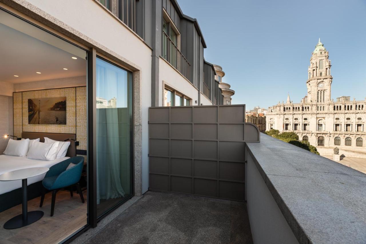 Eurostars Aliados Hotel Porto Bagian luar foto The hotel's balcony